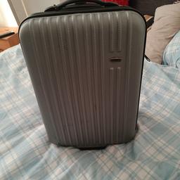 a small hand luggage grey suitcase all in condition make isglonaltrek