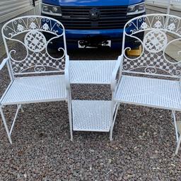 Ornate garden love seat in One piece a double seat With central atach table Purchased From Dobbis garden centre