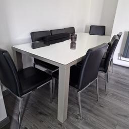 used table +8chairs mirrored top which could be removed . no demge only small scratches. chairs one small scratch on one of them not visable rest immaculate condition . can't deliver. any question or more pic just ask