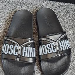BRAND NEW. In excellent/mint condition.
Never been used before.
Size 6. Black colour.
Ladies Moschino sliders - perfect for indoor and outdoor use.
100% Authentic/Original Moschino sliders.
£180 O.V.N.O accepted. Silly offers will be ignored.
Collection only.
Can post if postage costs are covered.