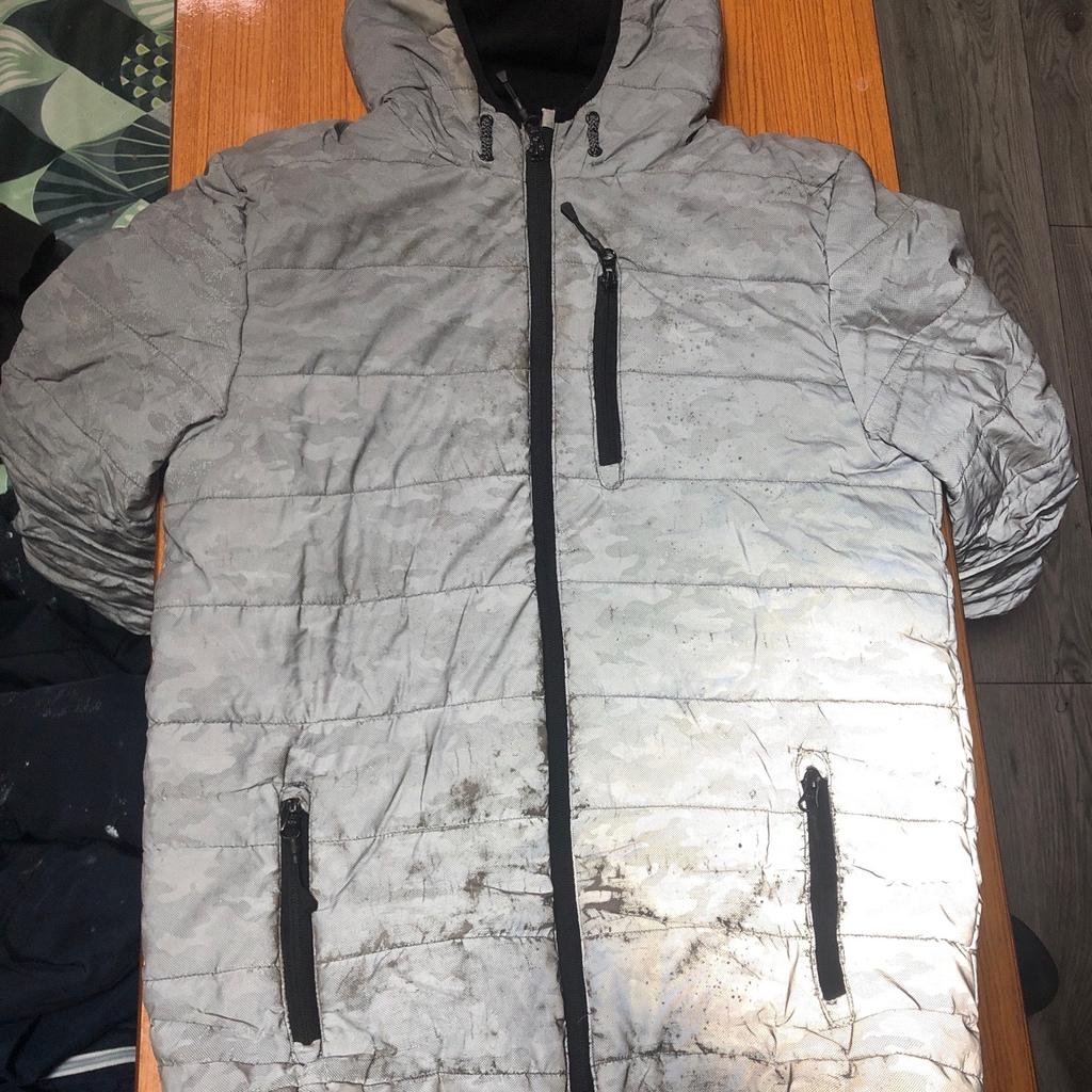 Boys coat shiny reflective night coat. Size is 13-14 years in good condition slight wear and tears. If bought then no return or exchange will be accepted cash and collection only.