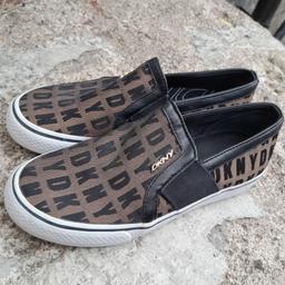 ■ PRICE: £65

■ SIZE 6.5 
▪ I think they're around a UK size 4/4.5?

■ CONDITION: GREAT - USED
▪ Worn twice, may have minor marks

■ INFO: 
▪ Brand: DKNY
▪ Colour: Black/Bronze
▪ Does not include shoe box
▪ DKNY print all over
▪ Logo emblem on outside
▪ Slip-on shoes
▪ Does NOT include shoe box

■ IMPORTANT:
▪︎ More pictures are available
▪︎ Selling as moving house/downsizing
▪ Cash on collection is preferred, but postage is also available

---

Tags: manchester Gorton Ashton Denton Openshaw Droylsden Audenshaw hyde tameside salford ancoats stockport bolton reddish oldham fallowfield trafford bury cheshire longsight worsley ladies trainers womens trainers size 4 trainers size 4.5 trainers dkny shoes designer trainers coach trainer slip on shoes donna karan new york genuine dkny