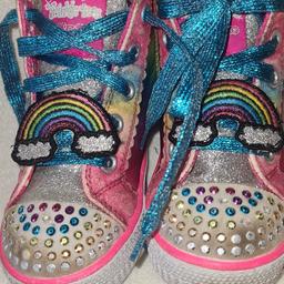 Girls Skechers Twinkle Toes Flashing Lights Hi Top Trainers. See photos for condition size flaws materials etc. I can offer try before you buy option if you are local but if viewing on an auction site viewing STRICTLY prior to end of auction.  If you bid and win it's yours. Cash on collection or post at extra cost which is £4.55 Royal Mail 2nd class. I can offer free local delivery within five miles of my postcode which is LS104NF. Listed on five other sites so it may end abruptly. Don't be disappointed. Any questions please ask and I will answer asap.
Please check out my other items. I have hundreds of items for sale including bikes, men's, womens, and children's clothes. Trainers of all brands. Boots of all brands. Sandals of all brands. 
There are over 50 bikes available and I sell on multiple sites so search bikes in Middleton west Yorkshire.
