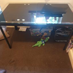 Black glass dinner table can be extended solid glass very heavy it’s been dismantled
