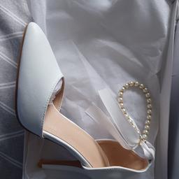 brand new white heel shoes. ideal for wedding, party or even a night out. size 4. collection only please. no time wasters.