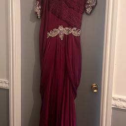 Size 10 gown with beautiful diamond and bead worn
Stylish and looks stunning wen worn
Only worn once