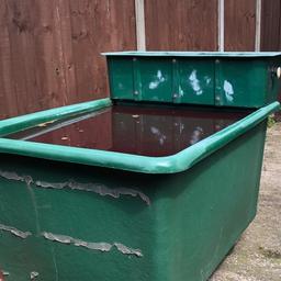 Fibreglass tank not used for a few years been stored in garage holds water also has a bottom drain has a filter that for to the top or you can add you own
