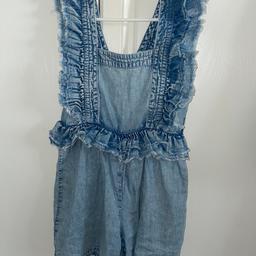 Denim jumpsuit with detailed edging to front, back and middle. Zip fastening. Age 7.