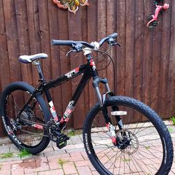 This is a TREK Ticket 10, a Very Rare bike, a TRUE Ultralite that's loaded to the brim with ALL that you'll need to make sure you’re kept safe whilst having the RIDE of your LIFE!

Ultralite 'Quick Release' 27.5 Wheel's
27.5 Bontrager 'XR2' Soft Touch Tyres
Shimano's 24 'Rapid Fire' Gears
HUGE - Disc Brakes (Front & Back)
Fully 'Adjustable' Extra LONG TRAVEL Suspension
Extra Wide Front Handle Bars
Leather SEAT, ALL Terrain 'Quick Release' wheels

This is essily a Thousand pound Plus Bike with Superb & Fantastic Paintwork.

This is one AMAZING & VERY CAPABLE HardTail Ultralite Bike!
Be the envy of your friends and grab this head Turner of a bike .....