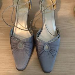 Satin silver k shoes. Size 4 1/2. Heal only small. Very comfy. & very elegant. Vgc. Collection only