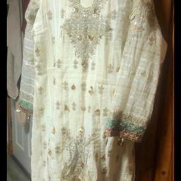 Creamy beige suit with multi coloured scarf in good condition