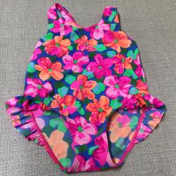 Marks & Spencer SWIMSUIT.

Age 2-3 Years
Purple background with Bright Pink flowers and Green leaves
Leg frill detail
80% Nylon, 20% Lycra

In excellent condition and from a smoke free home.

Buy with other Listed Items for a Bundle Price reduction.