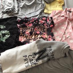 Girls clothing bundle 11-14yrs, 9 items- 1 pair New Look girls dark blue denim shorts with button fastening, 1 sweatshirt, 2 pair grey jogging bottoms, 3 tops, 1 pink spotty blouse & grey long sleeved top, £3, collection Mansfield