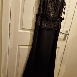 Looking for an elegant and classy evening dress? Check out this stunning size 16 black dress by Ignite, perfect for any formal occasion with an embellished belt and a soft and smooth fabric. The dress is crafted using high-quality materials to ensure maximum comfort and durability.

This floor length (58 inches) dress features a beautiful black colour, making it a timeless piece that can be worn season after season.

 Sensible offers are welcome