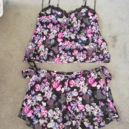 brand new with tags
stunning set 
top and shorts to wear at night
size medium
shorts size medium