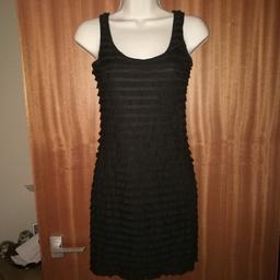 Black Bodycon Ruffle Dress.
Size 8.
From H&M.
Excellent condition.