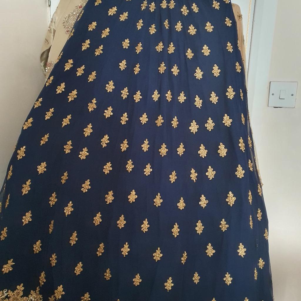 3 piece high low peplum navy and gold lengha ,heavy embroidery and stones all over ,worn once for a few hours,good as new.pick up only as very heavy to post.open to respectable offers.