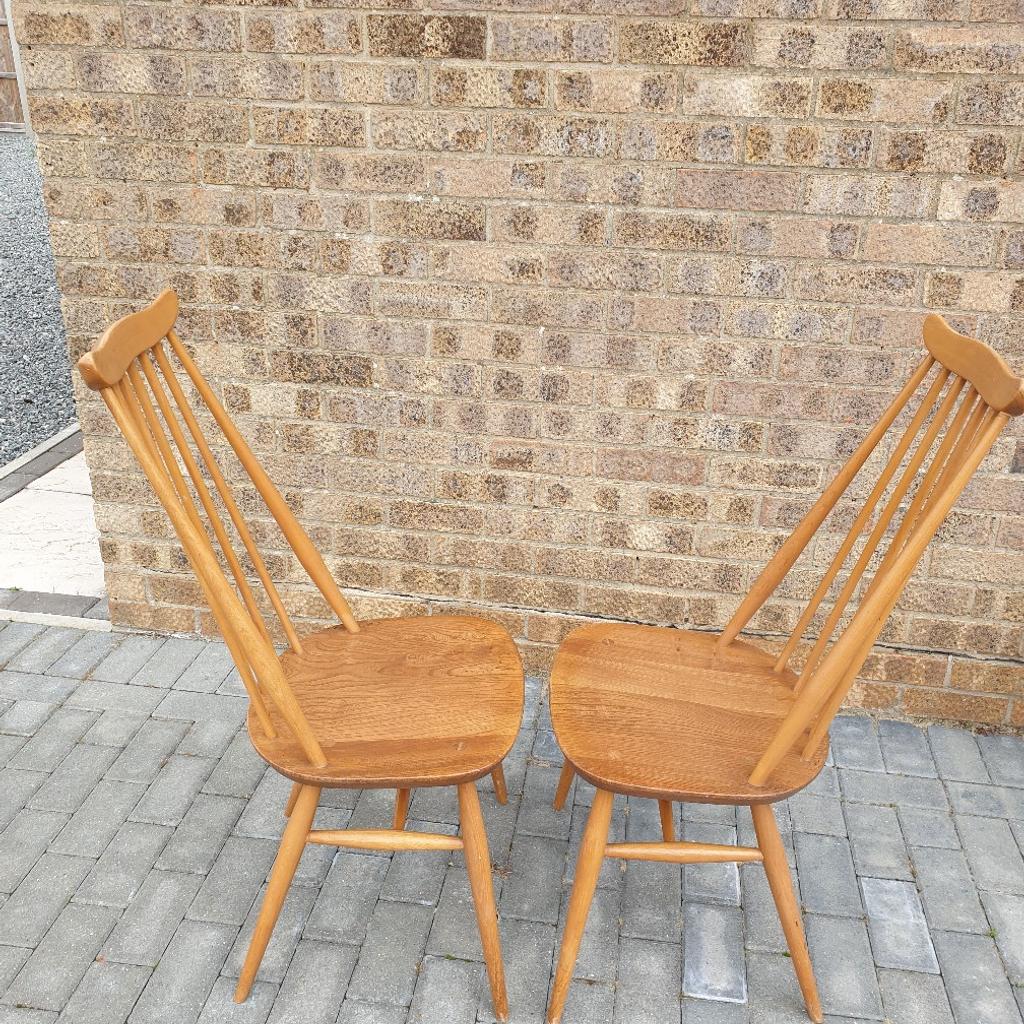 Two blonde Ercol Goldsmith Windsor dining chairs in good used condition. Possible delivery at a cost depending where you are.