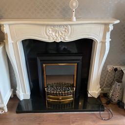 Electric fire and the fire place with black marble bottom half and on the back all working order lovely fire will need a wipe over selling on behalf of my nan collection only