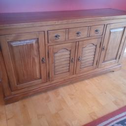 Large dresser with three cupboards and one wide drawer. Good quality pine with no knots, stained to look like oak. 1.8m long x 47cm deep
