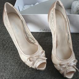 Catwalk Womens high-heels, size 5. Ivory and lace, perfect wedding shoes.
Only tried on inside, changed mind before the big day!
Excellent condition, BNWT!!!!. 

Safe collection available or delivery can be arranged for a small charge
Shipped within 24hrs if using Royal Mail or Yodel.
