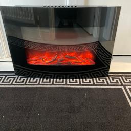 Electric fire with remote like new only had it for show. Width 66cm height 46 cm 