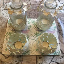 4 x TEA LIGHT HOLDERS.2 GLASS HANG UPS WITH CREAM METAL CASIINGS AND 2 METAL ONES FOR TABLE.NEW UNUSED. A BIT DUSTY FROM STORAGE..