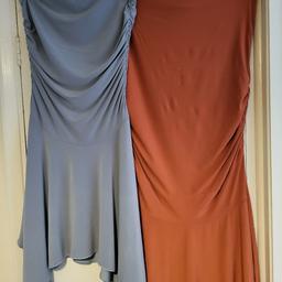 2 x strapless dresses with dipped hems . very starchy ideal for an occasion  or just beachwear. look better on than in picture.  can post if required  price for both