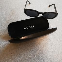 Eine Sonnen Brille von Gucci, Schwartz mit Original Etui.