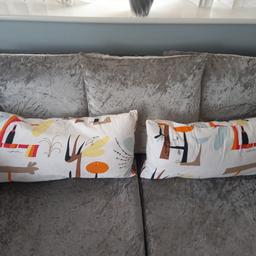 2 cushions could be used outside as well as in the house.These can be turned around because there isn't  a definite pattern.The second picture is them turned around.
