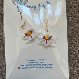 Cheeky Budgie small white orchid earrings. Brand new in package. £15 purchase price