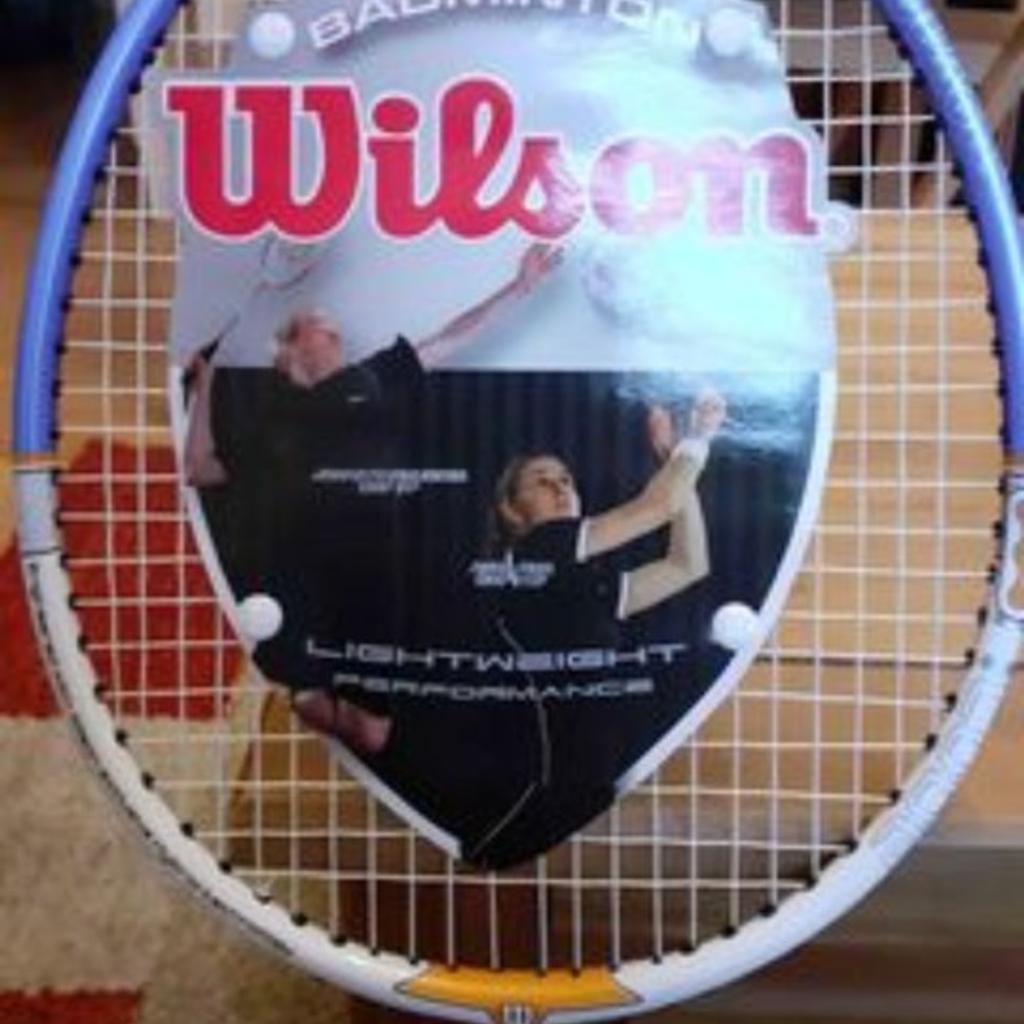Wilson badminton racket, new, never been used. RRP : £49.99 blue and gold.