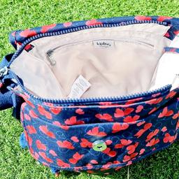 Kipling shoulder bag. Dark blue with red & light blue abstract design. Usual Kiplin features such as pockets & pouches inside. Large deep zip up pocket at the rear,with an equally large popper pocket to the front.Monkey called Gert. Price includes free UK mainland delivery. Thanks for looking.