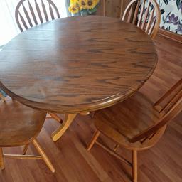 round oak table and chairs. slight water mark on top but can easily be fixed. 1 chairs spindle broke. very heavy. dismantled ready to go but can see it still. pickup only M40 area
