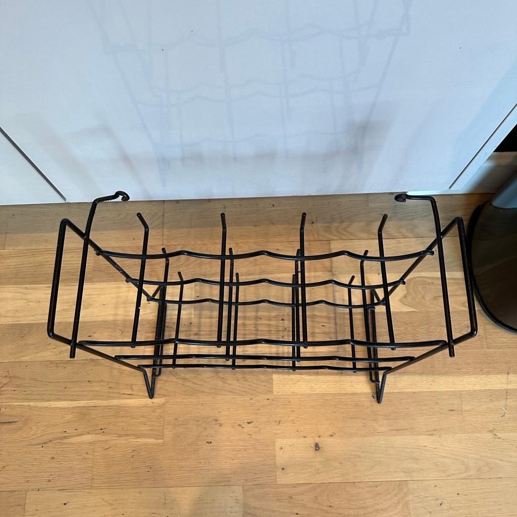 Black metal 12 Bottle wine rack in good used condition. Perfect to store bottles on and has no flaws. Collection Chelmsford or local delivery possible