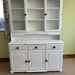 Solid pine Welsh dresser that has been painted white with pine handles. No major damage but could do with another coat of paint otherwise in good condition