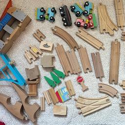 Wooden train set with tracks and trains
Some of the tracks have a few pen marks on them but don’t affect the use of the track.

Is a large bundle of track and will be heavy to post. Postage can be added if you require please ask for a postage price before buying
