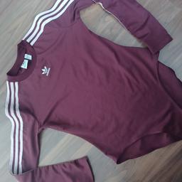 ladies adidas body suit size 12 good clean condirion maroon main colour with pink stripes on sleeves. £4 collect only.