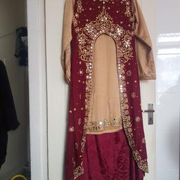 party/wedding trail suite
golden kameez with trouser
mirror work on arms and bottom border of kameez.
maroon trail top full of golden mirrors and beads.
size medium/large.
size 43.
slightly burn on back of top of kameez which can not be seen if trail on top
see pick
bought originally for £350