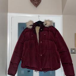 Women’s burgundy winter coat with gold detail, fur lining and fur around the hood which can be removed, very warm coat, only worn about 5 x, from a smoke and pet free home