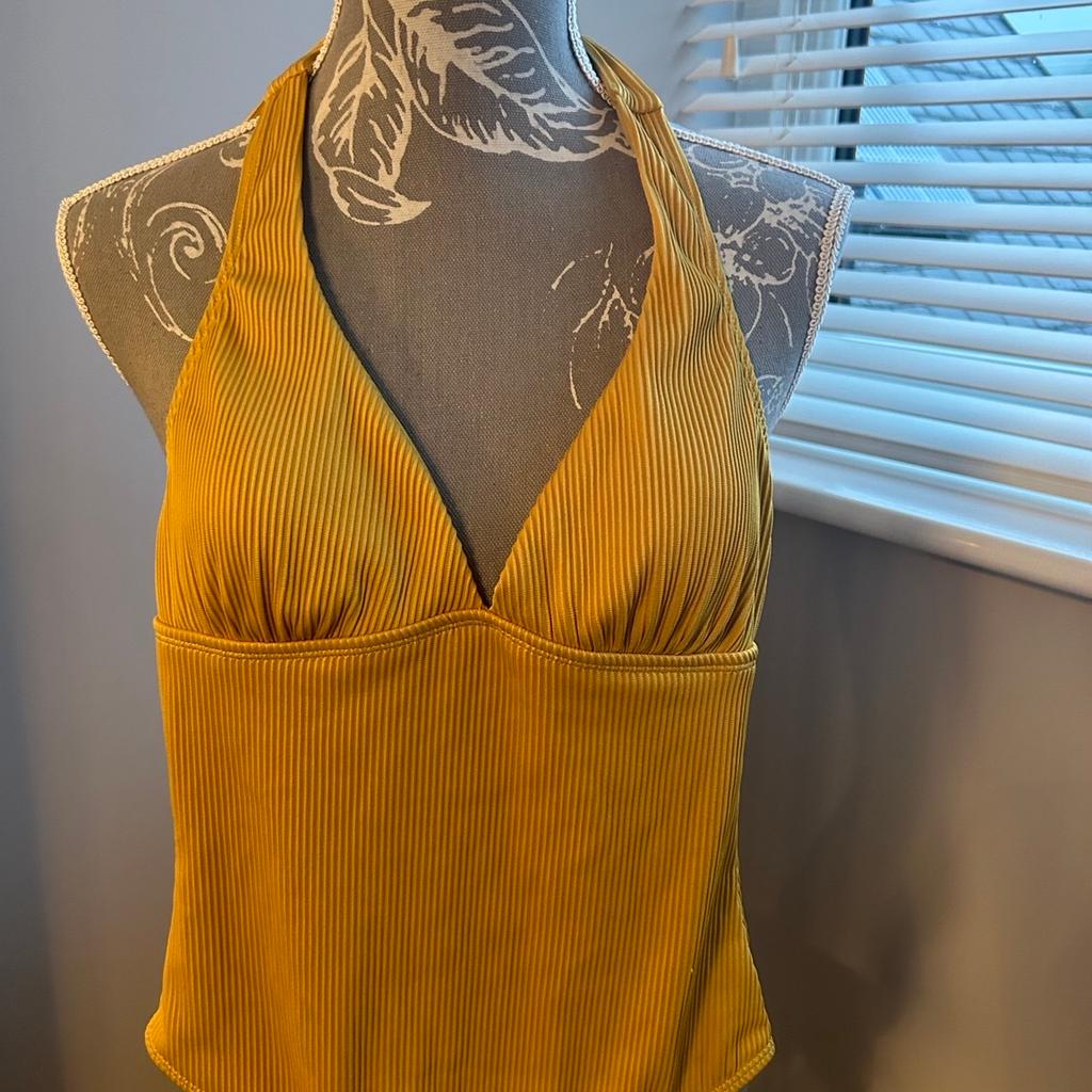 Only worn once
Excellent clean condition- like new
Halter neck textured swimsuit
Removable padded inserts in the bra cup
Mustard coloured
Listed on multiple sites
From a smoke free pet free home