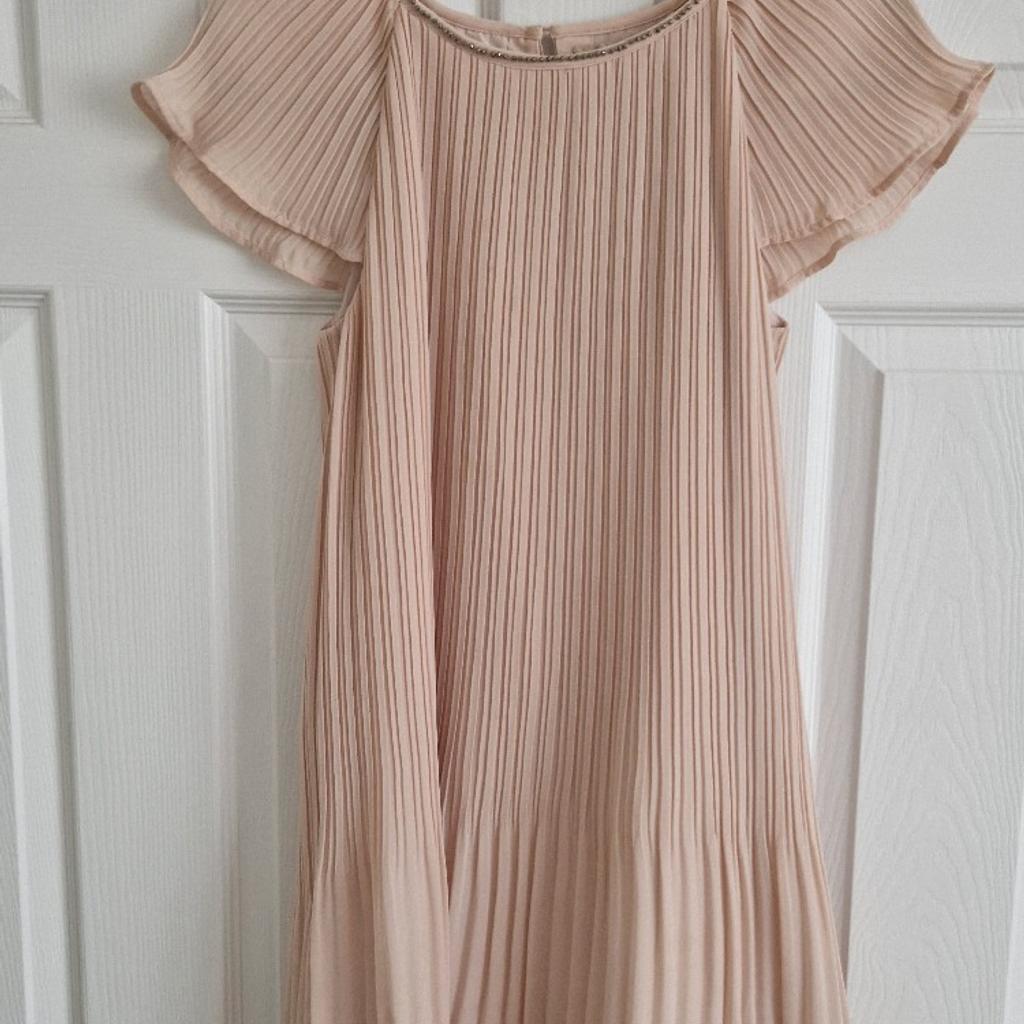 Girls pale pink pleated dress from Next.

Age 15 but will fit younger age.