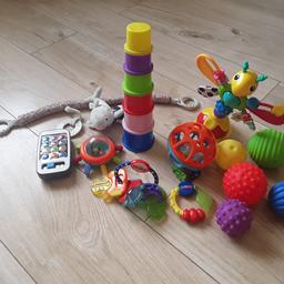 assortment  of toys  
5 sensory balls 
stacking  cups
highchair toy 
electronic  phone
2 teething  toys from nuby 
in excellent  condition