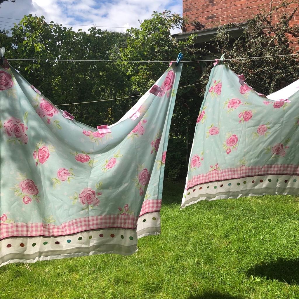 Gorgeous next curtains . 53x54 lively multicoloured curtains. Turquoise with pink roses and pink gingham tab tops. Multi spots in different colours to hemline . So pretty . Great curtains .