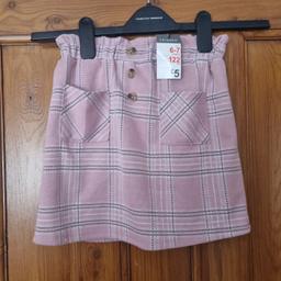 Make your little girl feel like a princess in this beautiful pink skirt from Primark. Perfect for any occasion, whether it's a party, casual outing, or a formal event. This knee-length A-line skirt is made of high-quality material and features a stylish design that is sure to catch everyone's eye. The skirt comes in size 6-7 years and is perfect for girls who love to dress up and have fun.

With its pink colour and comfortable fit, this skirt is sure to become a favourite among young fashionistas. Whether paired with a cute top or a stylish jacket, this skirt is the perfect addition to any little girl's wardrobe. So why wait? Get your hands on this must-have skirt today and make your little girl feel like a true princess!