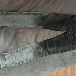 Black and grey Tommy Hilfiger jeans, 28W/32L, in excellent condition.