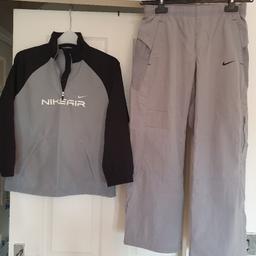 Nike child's Two Peice Tracksuit 
Only worn once
Clean and in very good condition 
Elasticated waist with draw strings tie
Pocket at front of top
Cash on collection please