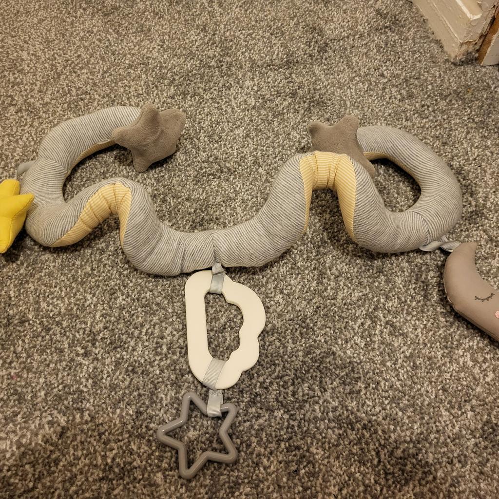 Gorgeous, grey & yellow, spiral activity toy in vgc, moon & stars themed.

The toy has 3 stars (one which rattles) and a moon, plus a teether with another star on it.