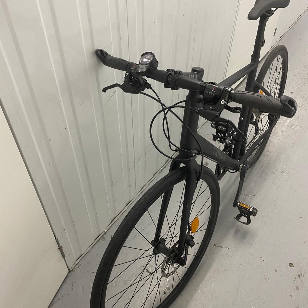 Triban (BLACK) flat bar mountain bike. Never used. In new condition, has been kept in storage since purchased.