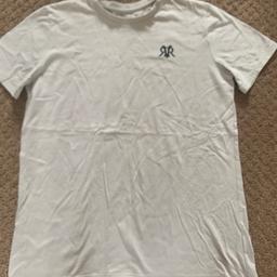 Stone colour boys River Island T-shirt
Age 11 to 12 years 
Slim fit 
Embroidered logo on chest 
Worn, but great condition
Pet and smoke free home